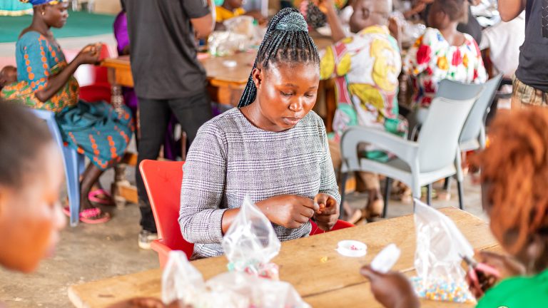 Women learning beads